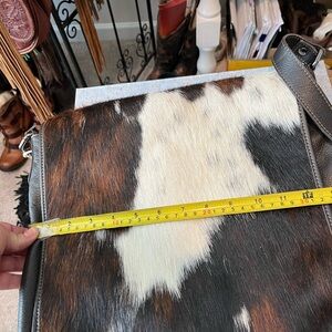 Cowhide bag and can fit a lot of stuff and still be organized!